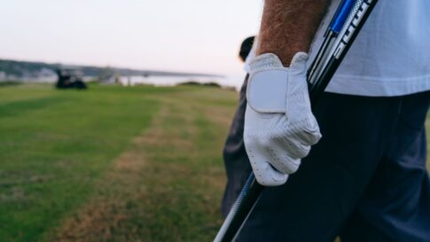 Golf glove and club detail for a round packing checklist